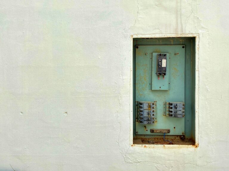 Cómo Legalizar una Instalación de Autoconsumo en España: Paso a Paso: gray and white wall mounted telephone